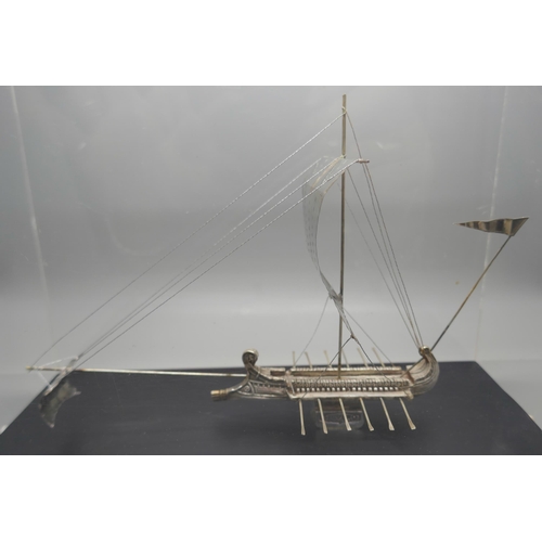 900 - A silver model of an ancient Greek warship, marked 925 and 999, in a Perspex case, height of case 19... 