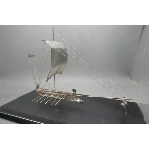 900 - A silver model of an ancient Greek warship, marked 925 and 999, in a Perspex case, height of case 19... 