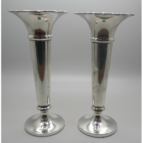 902 - A pair of Walker & Hall silver vases, weighted, 17.5cm