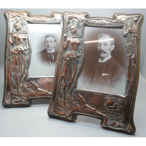 908 - A pair of Edwardian copper and brass frames with wooden panel backs, Viking scenes embossed, height ... 