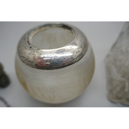 909 - A silver rimmed match striker, a silver topped cut crystal pot, a silver sherry label, a silver scen... 