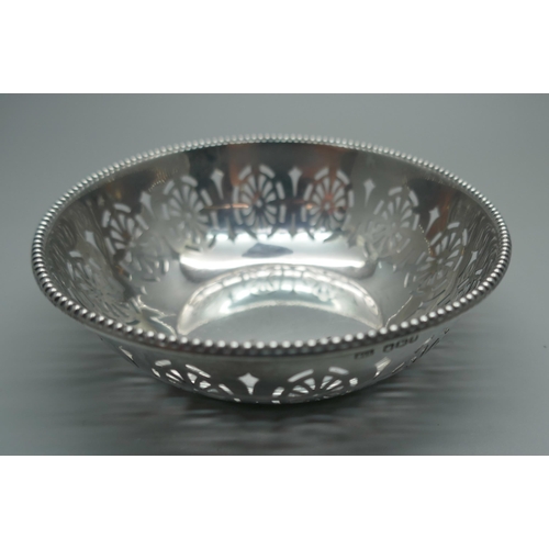 911 - A pierced silver dish, Walker & Hall, 42g, diameter 10cm