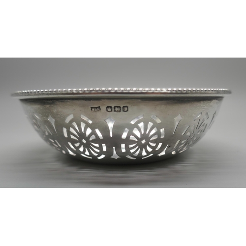 911 - A pierced silver dish, Walker & Hall, 42g, diameter 10cm