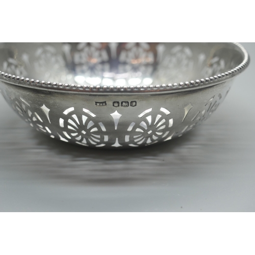 911 - A pierced silver dish, Walker & Hall, 42g, diameter 10cm