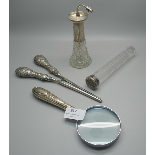 912 - A pair of silver handled glove stretchers, silver handled magnifying glass, a silver topped glass ha... 