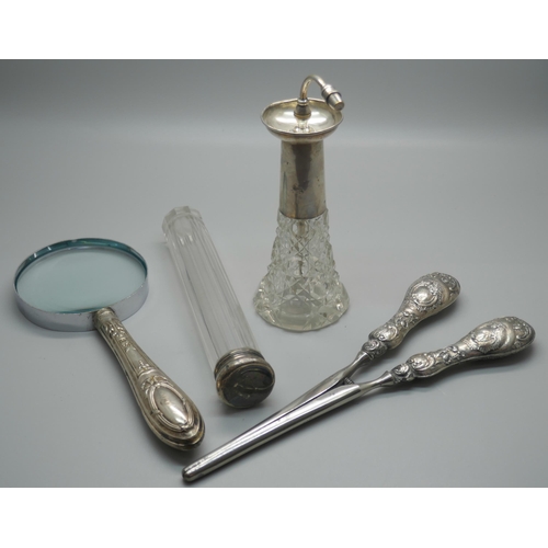 912 - A pair of silver handled glove stretchers, silver handled magnifying glass, a silver topped glass ha... 