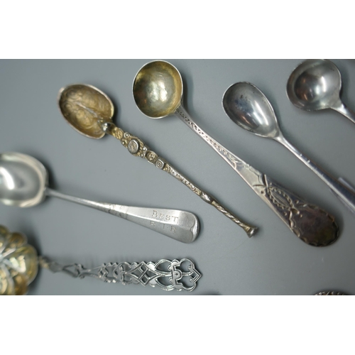 915 - A collection of silver spoons including a sifter spoon, 155g