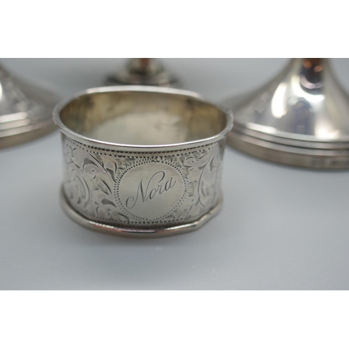 916 - A pair of silver dwarf candlesticks, a silver pedestal bon-bon dish and a silver napkin ring, (dish ... 