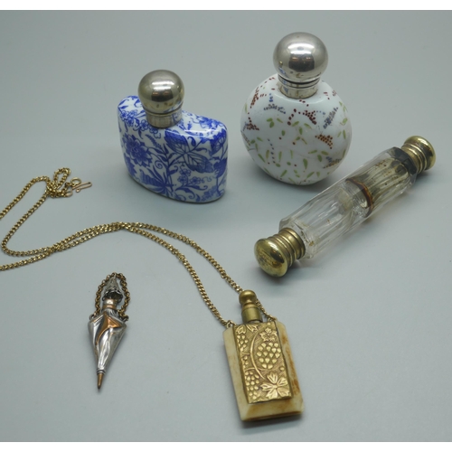 918 - Five scent bottles; a blue and white porcelain scent flask, a Victorian clear glass double ended, wh... 