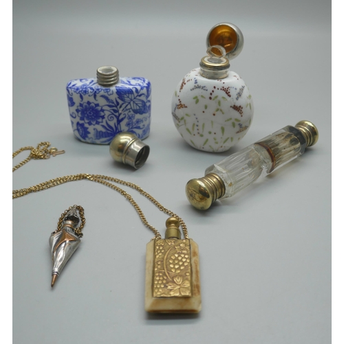 918 - Five scent bottles; a blue and white porcelain scent flask, a Victorian clear glass double ended, wh... 