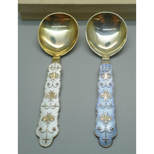 920 - Two silver and enamelled spoons, J. Tostrup, Norway, blue enamel a/f, with one Tostrup box, 67g, 14.... 