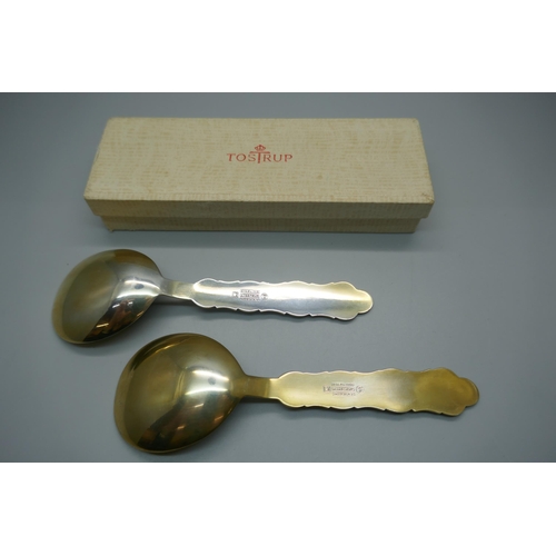 920 - Two silver and enamelled spoons, J. Tostrup, Norway, blue enamel a/f, with one Tostrup box, 67g, 14.... 