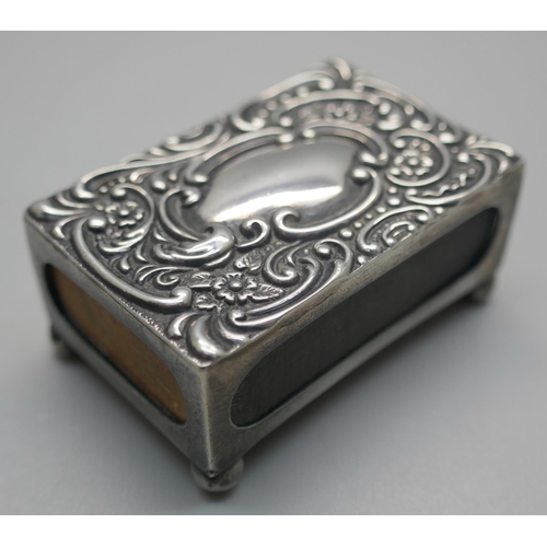 927 - A Victorian silver embossed matchbox holder, Birmingham 1900