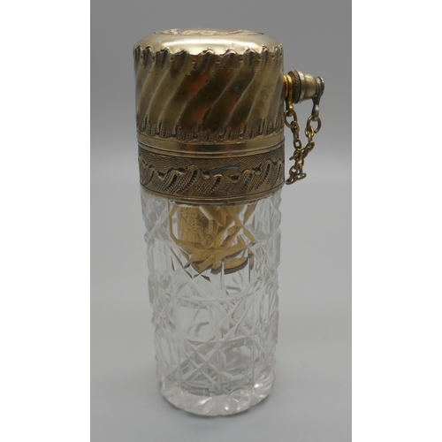 931 - A cut glass atomiser with gilt metal top, scratched initial 'M'