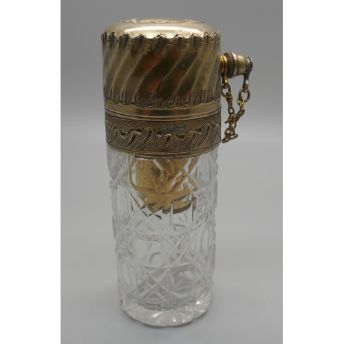 931 - A cut glass atomiser with gilt metal top, scratched initial 'M'