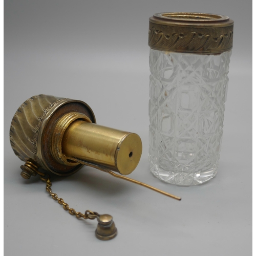 931 - A cut glass atomiser with gilt metal top, scratched initial 'M'