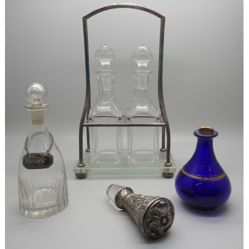 941 - A WMF two bottle stand with two bottles, two other bottles, one with white metal 'soy' label and a V... 