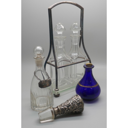 941 - A WMF two bottle stand with two bottles, two other bottles, one with white metal 'soy' label and a V... 