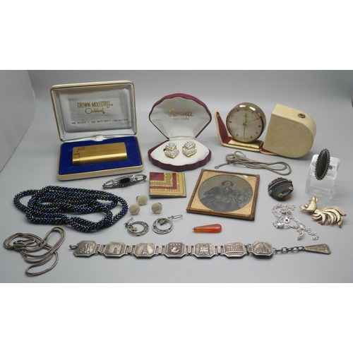 945 - A collection of costume jewellery including a silver bar brooch, a lighter, etc.