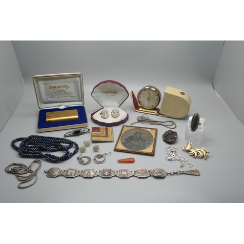 945 - A collection of costume jewellery including a silver bar brooch, a lighter, etc.