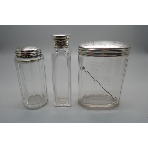 953 - Three silver topped jars, including London 1899, (oval), and Birmingham 1897, (medium)