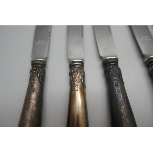 954 - A silver spoon, 25g and five silver handled pistol grip knives