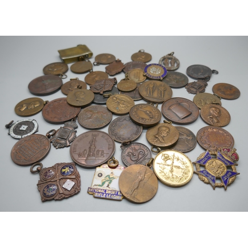 957 - A collection of fobs and medallions including Rifle Club related, Georgian and Victorian coins