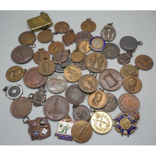 957 - A collection of fobs and medallions including Rifle Club related, Georgian and Victorian coins