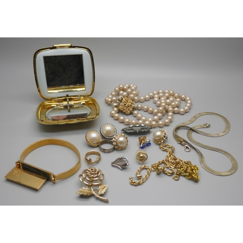 977 - Costume jewellery and a handbag mirror