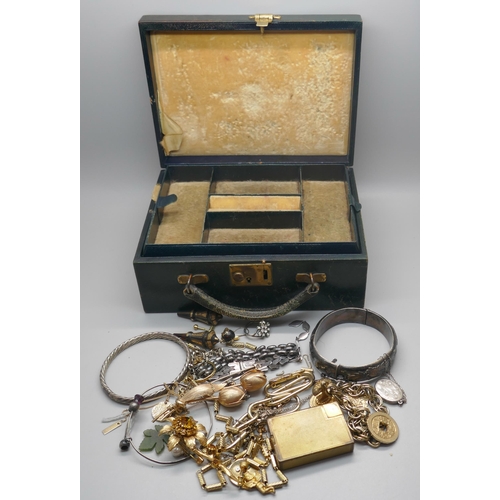 981 - A leather jewellery box containing silver jewellery and costume jewellery and a pair of Victorian ea... 