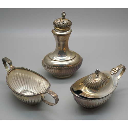 993 - A silver three piece cruet set, Birmingham 1974, Hampton Utilities, 172g