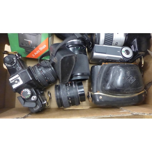 2070 - A box of 35mm cameras and 4 lenses with 2 digital cameras