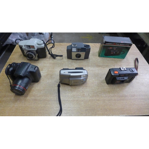 2081 - A box of various cameras and accessories