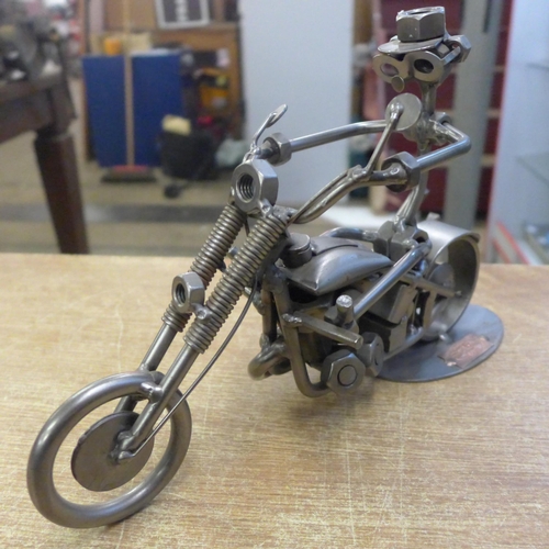 2091 - A Hinz & Kunst metal figurine, man riding chopper motorcycle