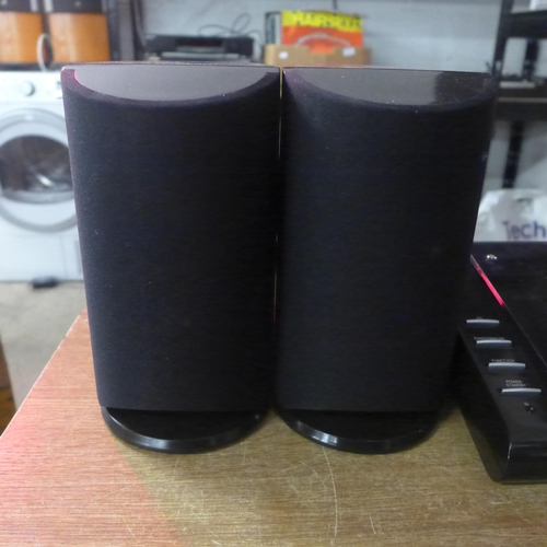 2115 - A Polaroid CD player (KS-3398A), a pair of Polaroid speakers (KS-3398A) and a box of CDs