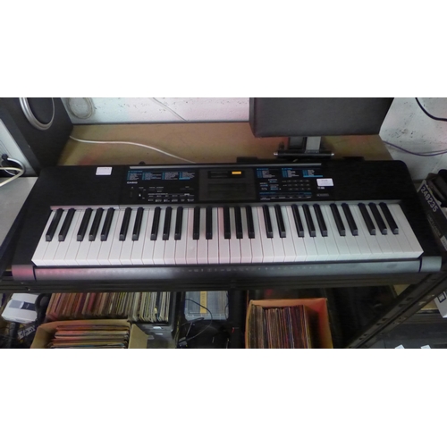 2126 - A Casio LK-170 electric keyboard and keyboard seat