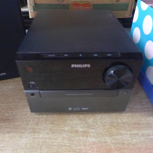 2128 - A Phillips CD player (BTM2310105) with matching speakers and a box of CDs