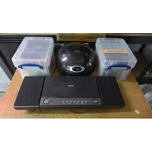 2131 - 2 Radios/players, 2 Polaroid (PLA18AV003) and a Polaroid (PK5-818A) and two boxes of CDs