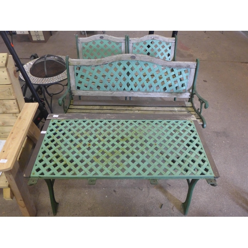 2165 - A cast iron bench set, a bench, two chairs and a table