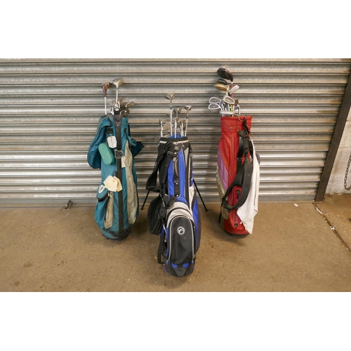 2182 - 3 Golf bags with various golf clubs