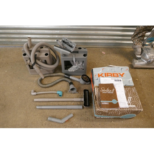 2183 - A Kirby vacuum and a large box of accessories