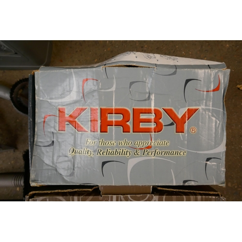 2183 - A Kirby vacuum and a large box of accessories