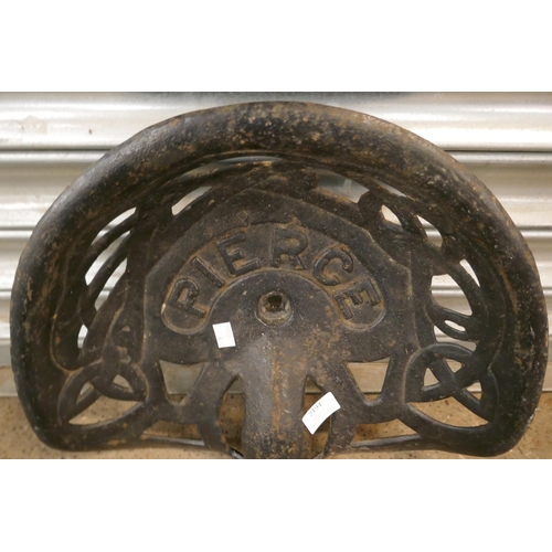 2194 - A Pierce cast metal tractor seat