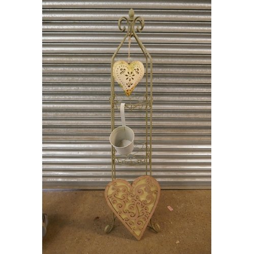 2197 - A plant stand, a heart garden decoration and solar powered garden light