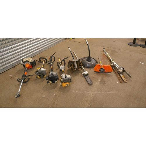 2200 - 4 Petrol multi-tools; 2 Ryobi, Bauker SCB30 and one other with attachments