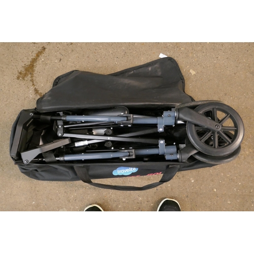 2203 - A folding Travel Light wheelchair