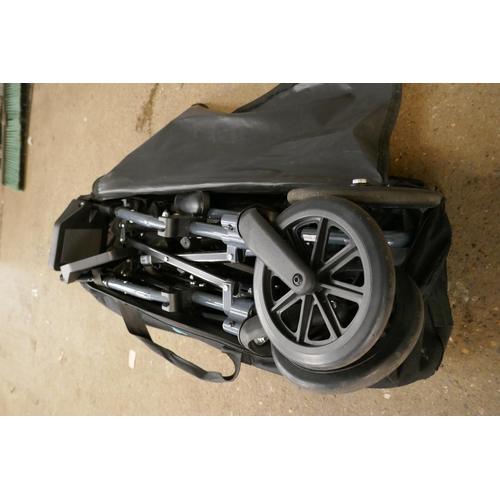 2203 - A folding Travel Light wheelchair