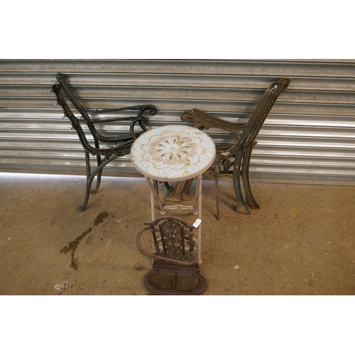 2219 - 2 Sets of cast metal bench ends, folding metal table and stick stand