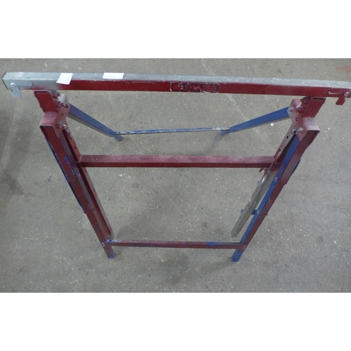 2238 - A metal folding trestle table and a plaster board support tool