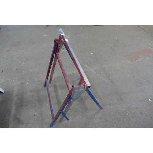 2238 - A metal folding trestle table and a plaster board support tool